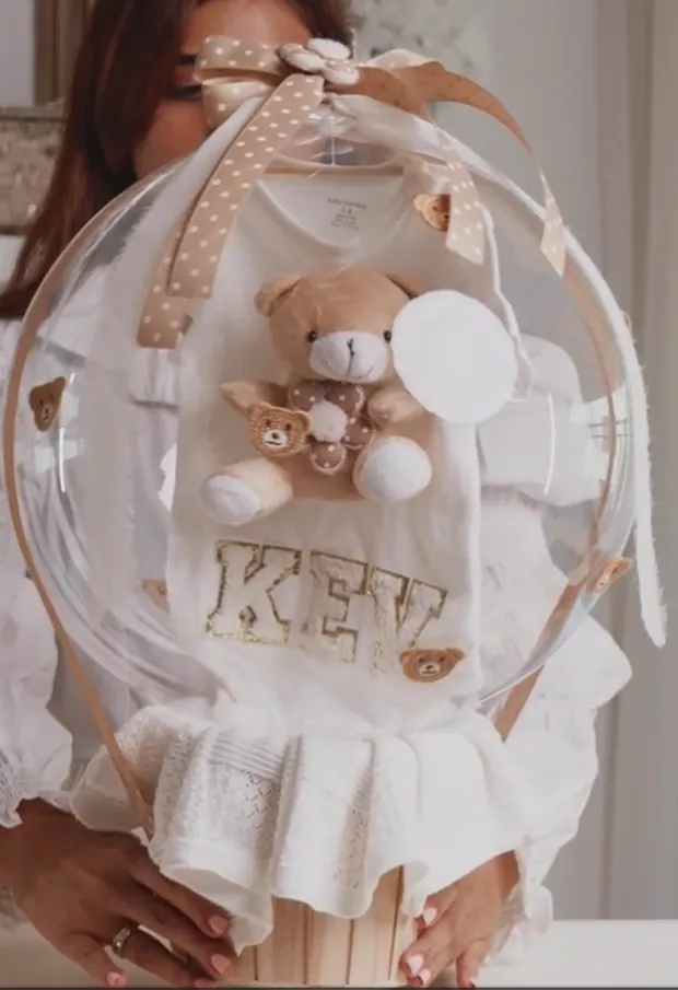 A personalised baby keepsake hamper with a teddy and name detail